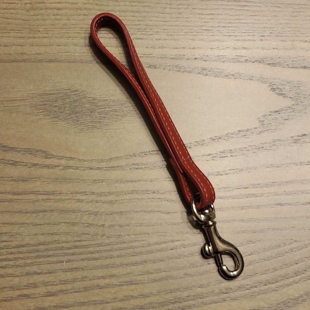 Small Red Coach Wristlet strap with red stitching